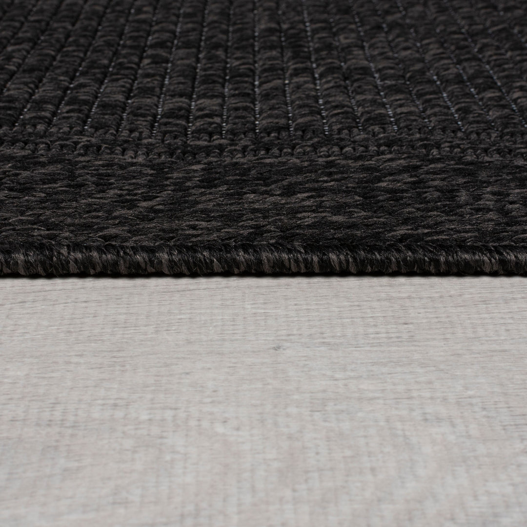 finition du tapis en jute noir de la marque flair rugs#couleur_charbon