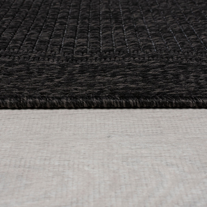 finition du tapis en jute noir de la marque flair rugs#couleur_charbon