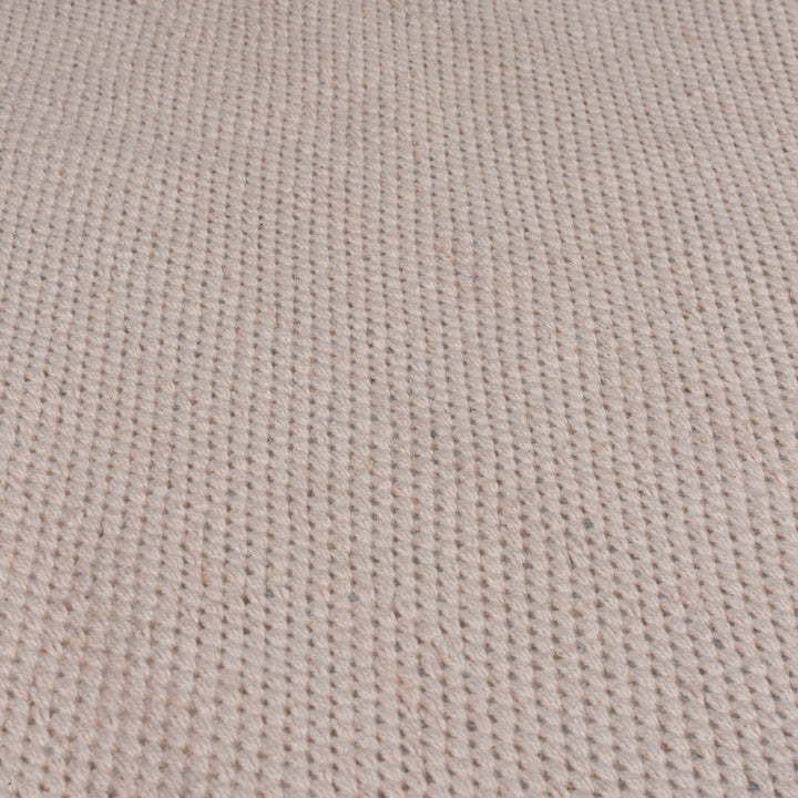 zoom sur la matière du tapis pompom coloris rose#couleur_rose