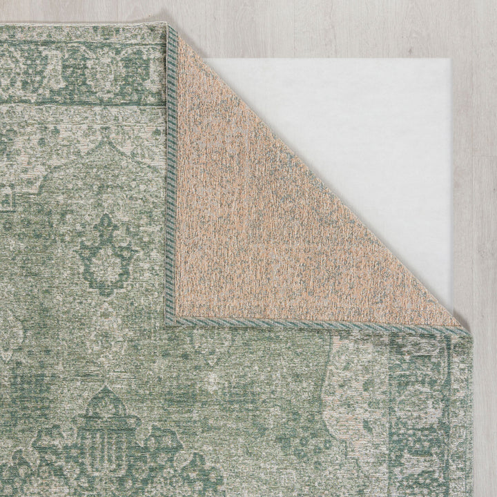 zoom sur le tapis vintage vert de salon pour voir l'envers du tapis #couleur_vert